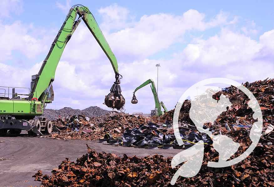 This image shows a recycling facility with large piles of scrap metal. Two green material handlers with grapple attachments are sorting and moving the debris.